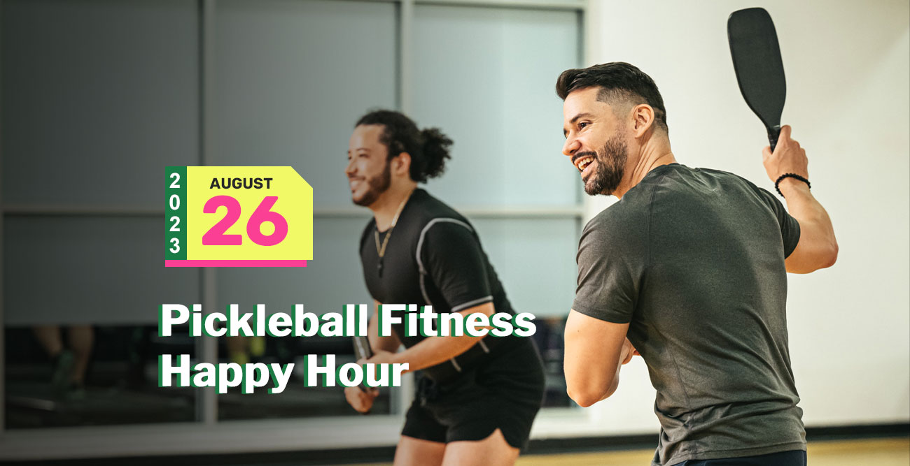 Two men are enjoying a fun-filled game of pickleball indoors, both smiling as they prepare to hit the ball. The date "August 26, 2023" is displayed in colorful text on the left, with the event name "Pickleball Fitness Happy Hour" below it—a perfect blend of exercise and entertainment.