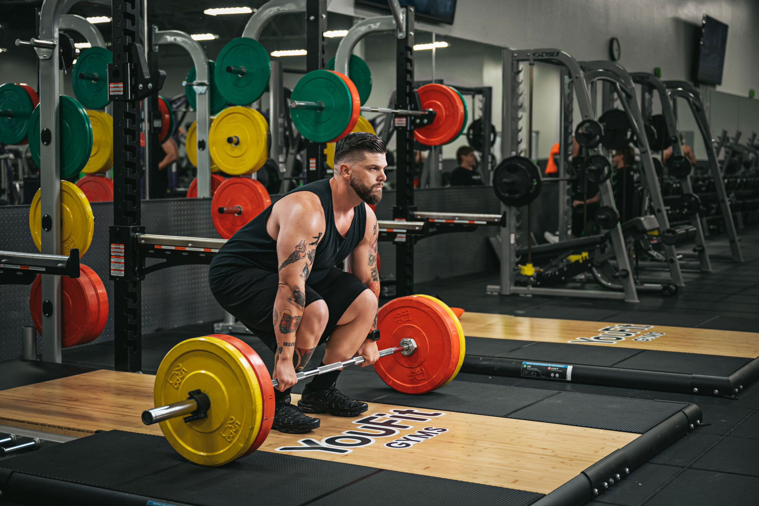 giant olympic weightlifting man lifts giant barbell